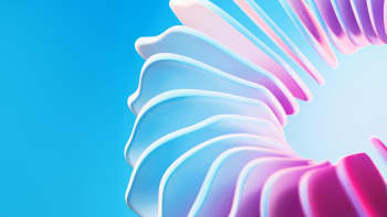 A close up of a pink and blue flower